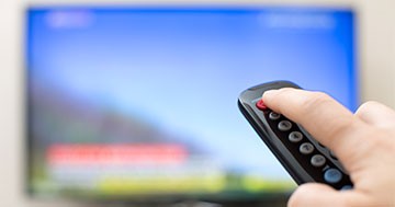 person turning tv off