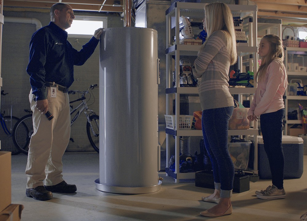Constellation employee fixing water heater